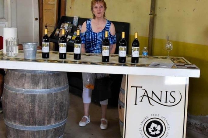 a man and a woman standing in front of a counter