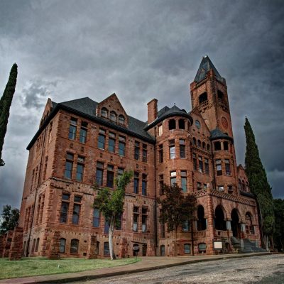 a castle with a clock tower in front of Preston School of Industry