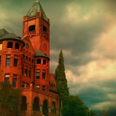 a large brick building with a clock tower