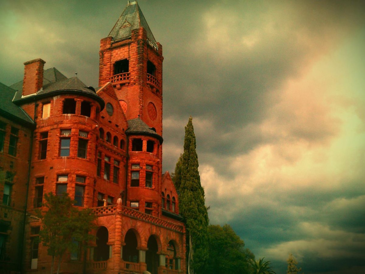 a large brick building with a clock tower