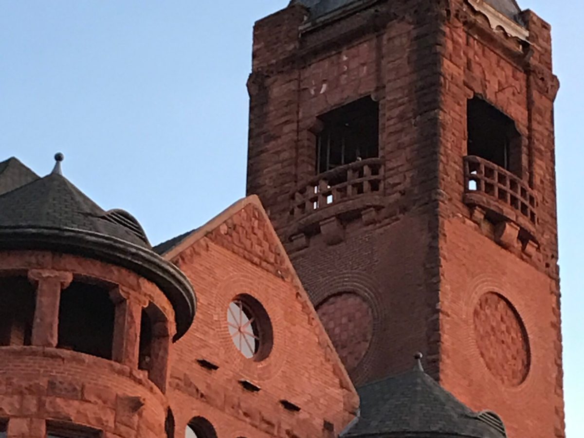 a large brick building with a clock tower