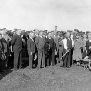 a group of people standing in front of a crowd posing for the camera