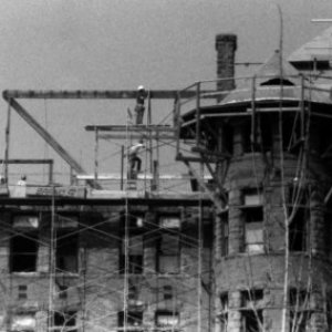a boat is docked next to a building