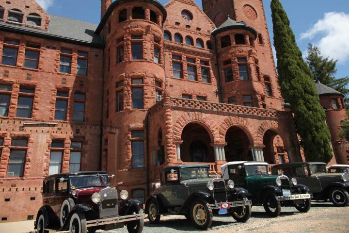 a car parked in front of a brick building