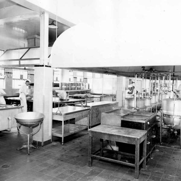 a kitchen with a table in a restaurant