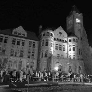 a group of people in front of a building