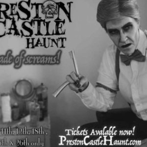 a person holding a sign posing for the camera