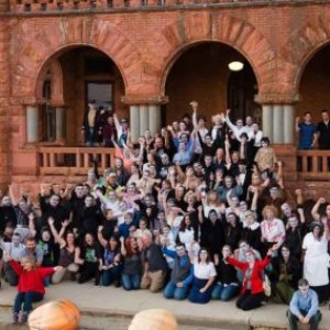 a group of people walking in front of a crowd