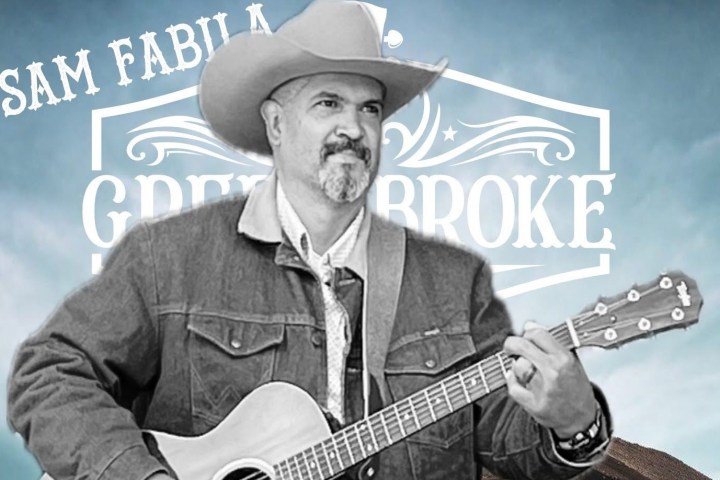 a man holding a guitar