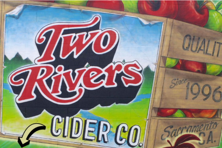 Mural with 'Two Rivers Cider Co.' and apple crates, with text 'Quality Since 1996' and 'Sacramento, CA'.