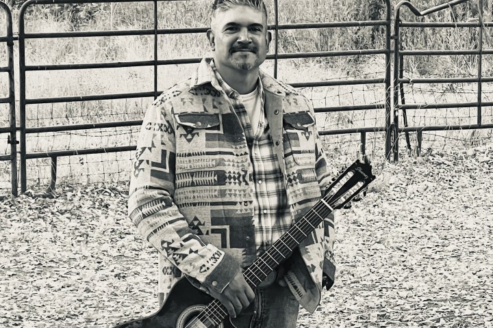 a man holding a guitar